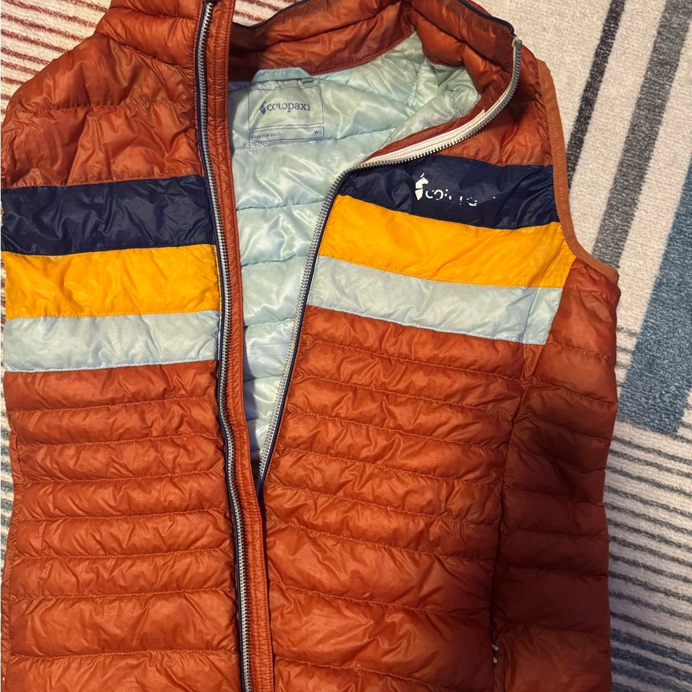 Cotopaxi Fuego Rust Orange Quilted Vest with Navy, Yellow & Light Blue Panels WS